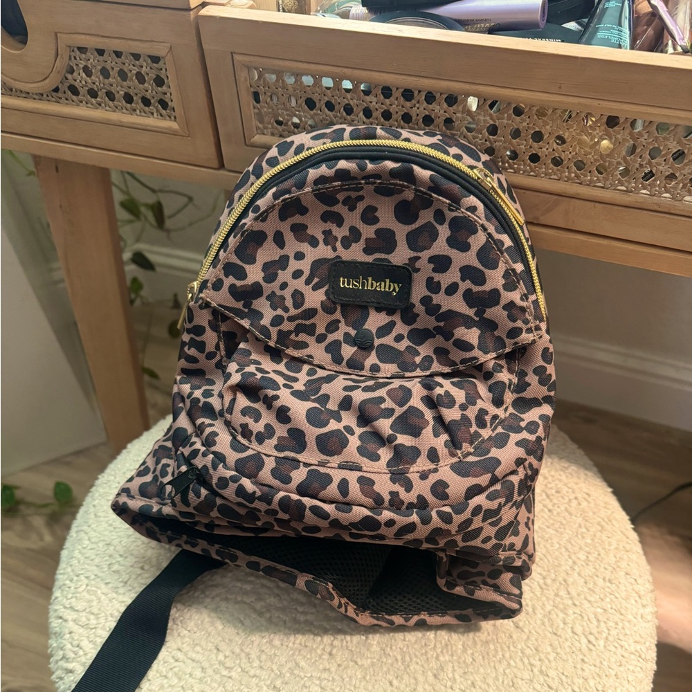 Like new leopard print TushBaby Hip Carrier